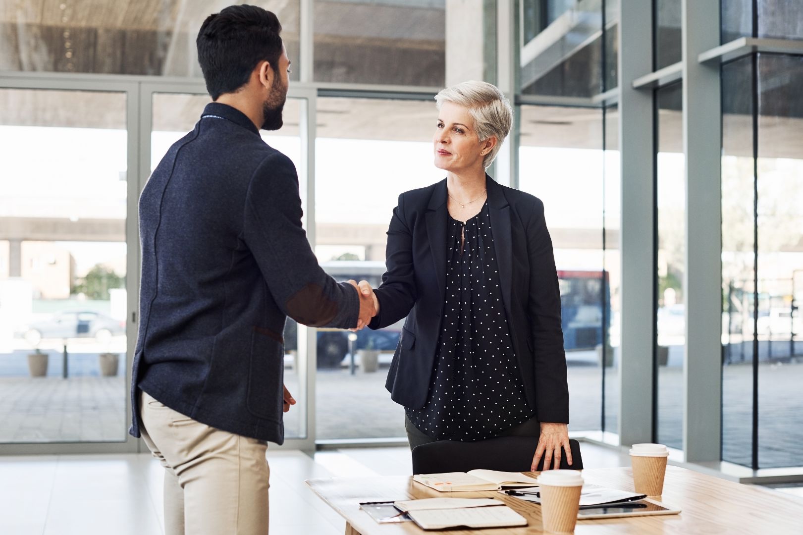 Lawyer greeting a client